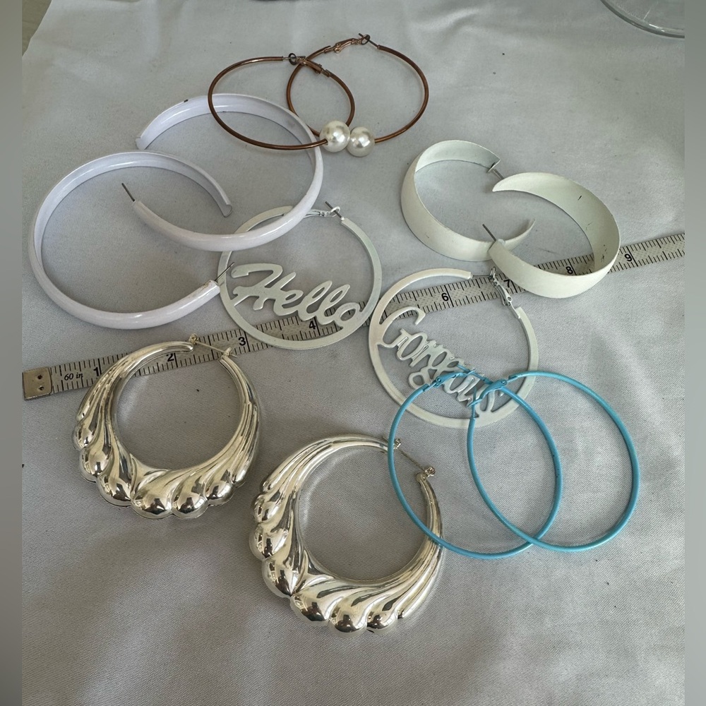 Six pairs of large hoop earrings